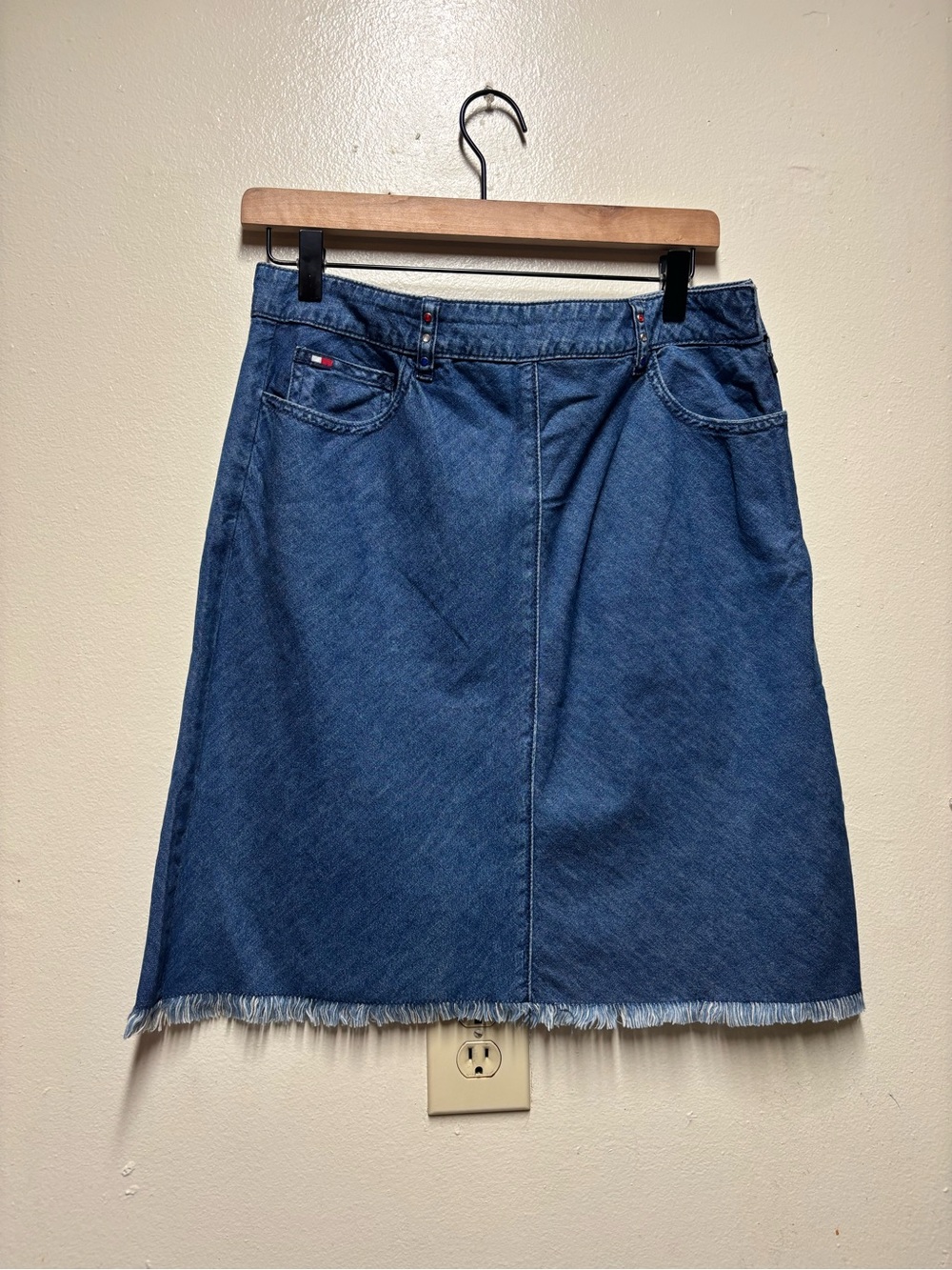 Vintage Tommy Hilfiger Tommy Jeans denim skirt in a classic medium blue wash.